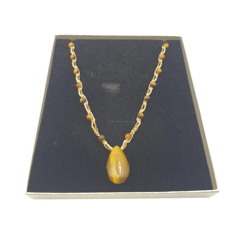 Ma boutique teardrop tiger's eye pendant necklace with braided cord and small tiger's eye beads.